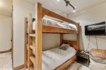 First floor has an adult-sized longer bunk bed and a half bath 